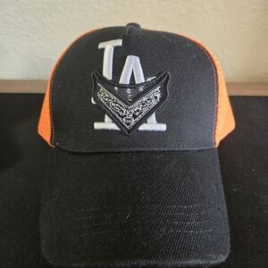 NWOT LA with Bandana Logo. Black and Orange Mesh Snap Back Trucker Hat.